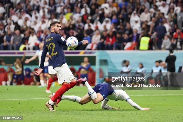 Mason Mount of England is challenged by Theo Hernandez of France in the box leading to the video assistant referee review resulting in penalty...