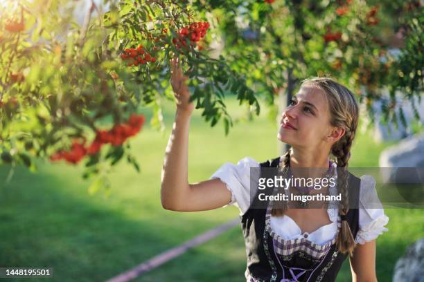 portrait of a teenage girl wearing traditional austrian dress - dirndl - dirndl stock pictures, royalty-free photos & images