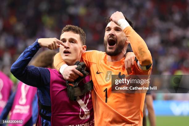 Benjamin Pavard and Hugo Lloris of France celebrate after the 2-1 win during the FIFA World Cup Qatar 2022 quarter final match between England and...