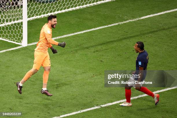 Hugo Lloris of France reacts with teammates after Harry Kane of England missed a penalty during the FIFA World Cup Qatar 2022 quarter final match...