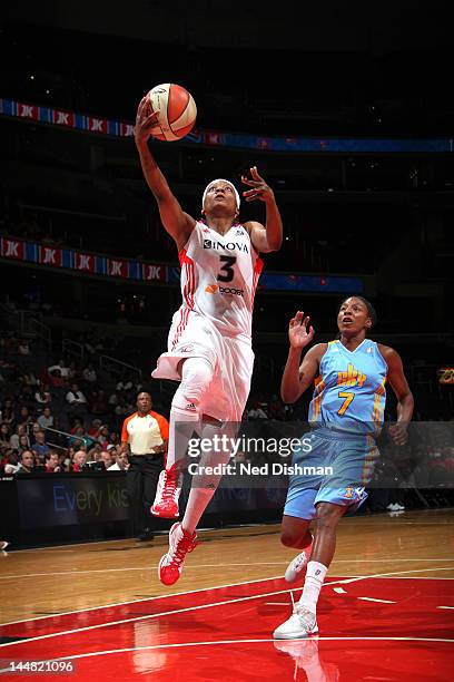 Dominique Canty of the Washington Mystics shoots against Eshaya Murphy of the Chicago Sky at the Verizon Center on May 19, 2012 in Washington, DC....