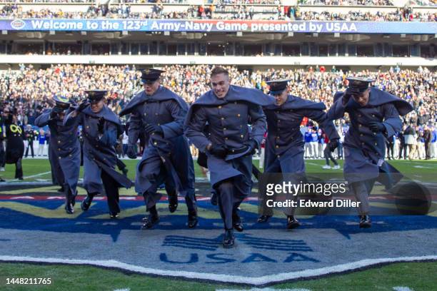 Army Black Knights run to join their classmates after the prisoner exchange at Lincoln Financial Field on December 10, 2022 in Philadelphia,...
