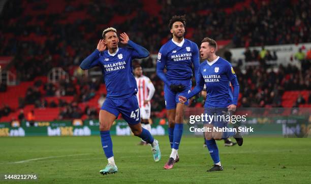 Callum Robinson of Cardiff City celebrates after he scores their second goal during the Sky Bet Championship between Stoke City and Cardiff City at...