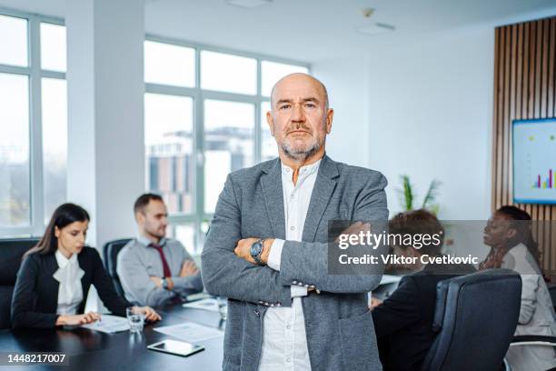 portrait of a successful senior businessman at the office team meeting - old wise business man white stock pictures, royalty-free photos & images