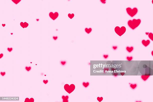 many pink valentine's day hearts falling on pastel pink background. holiday backdrop for your design. three dimensional illustration. demonstrating viva magenta - trendy color of the year 2023 - symbole amoureux photos et images de collection