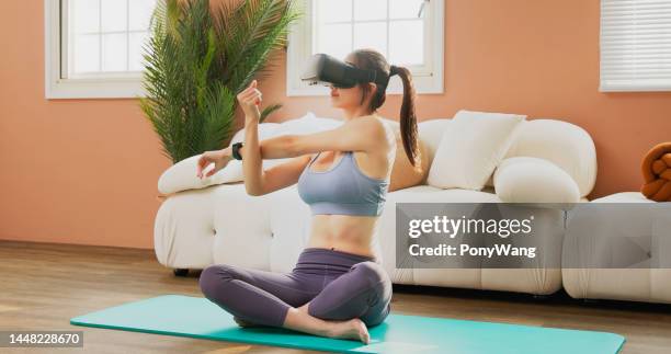 woman doing yoga - virtual coach stock pictures, royalty-free photos & images