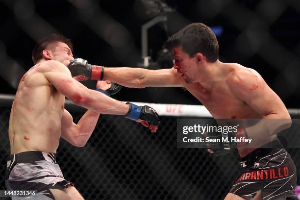 Billy Quarantillo punches Alexander Hernandez in a featherweight fight during the UFC 282 event at T-Mobile Arena on December 10, 2022 in Las Vegas,...