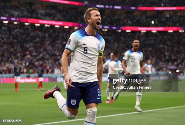 Harry Kane of England celebrates scoring their goal from the penalty spot during the FIFA World Cup Qatar 2022 quarter final match between England...