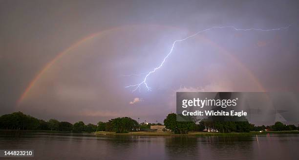 Rainbow and lightning strike from the banks of the Little Arkansas River near downtown Wichita, Kansas, on Saturday, May 19, 2012. A series of...
