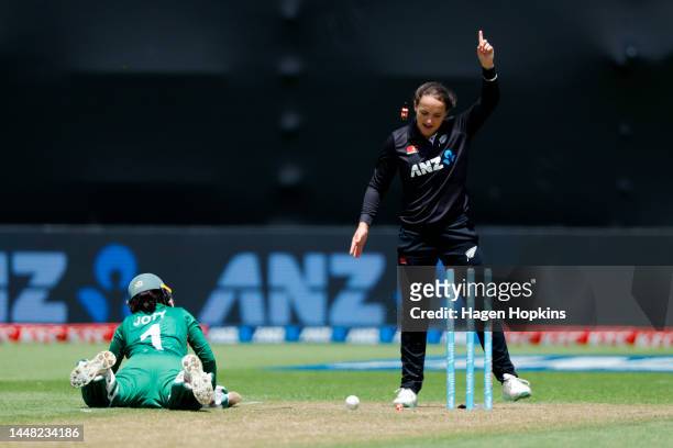 Amelia Kerr of New Zealand looks on as Nigar Sultana of Bangladesh is dismissed by a direct hit to the wickets during the first One Day International...