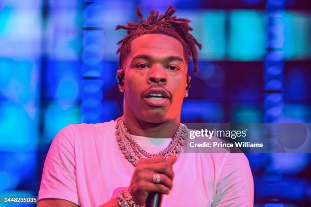 Rapper Lil Baby performs onstage during "Lil Baby & Friends Birthday Celebration Concert" at State Farm Arena on December 9, 2022 in Atlanta, Georgia.