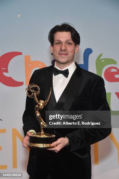 James A. Castillo, winner of the Outstanding Interactive Media award for "Madrid Noir, poses in the press room during the 2022 Children's & Family...