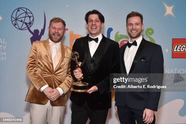 Tom Flavelle, James A. Castillo, and Luke Gibbard, winners of the Outstanding Interactive Media award for "Madrid Noir", pose in the press room...