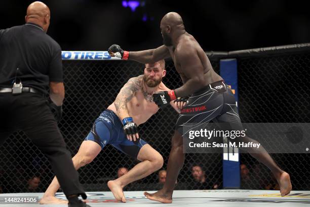 Jairzinho Rozenstruik of Suriname punches Chris Daukaus in a heavyweight fight during the UFC 282 event at T-Mobile Arena on December 10, 2022 in Las...