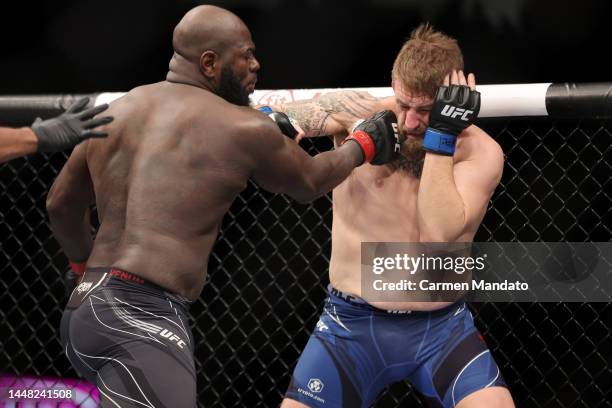 Jairzinho Rozenstruik of Suriname punches Chris Daukaus in a heavyweight fight during the UFC 282 event at T-Mobile Arena on December 10, 2022 in Las...