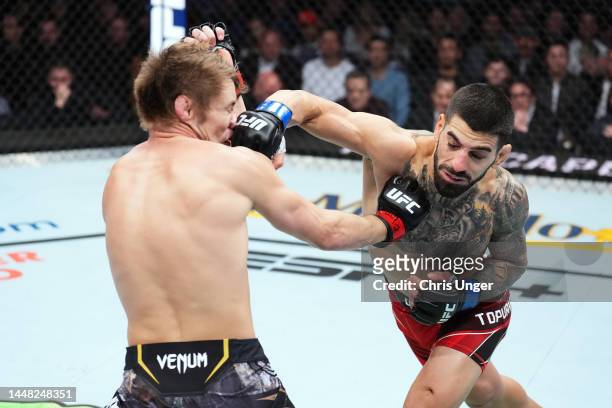 Ilia Topuria punches Bryce Mitchell in a featherweight fight during the UFC 282 event at T-Mobile Arena on December 10, 2022 in Las Vegas, Nevada.