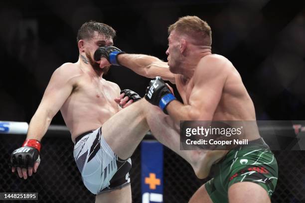 Dricus Du Plessis of South Africa punches Darren Till of England during the UFC 282 event at T-Mobile Arena on December 10, 2022 in Las Vegas, Nevada.