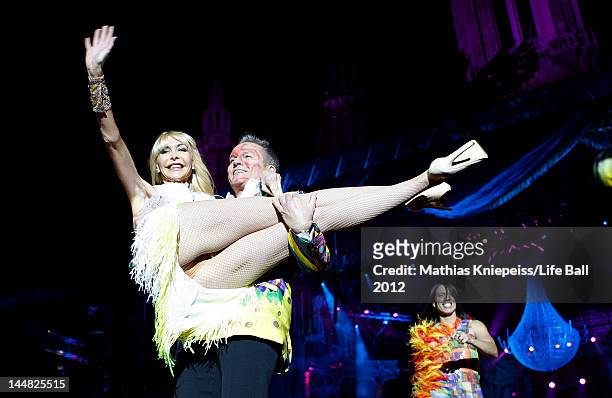 Dolly Buster and Alfons Haider are seen on the catwalk at the Life Ball 2012 AIDS charity fundraiser at City Hall on May 19, 2012 in Vienna, Austria.