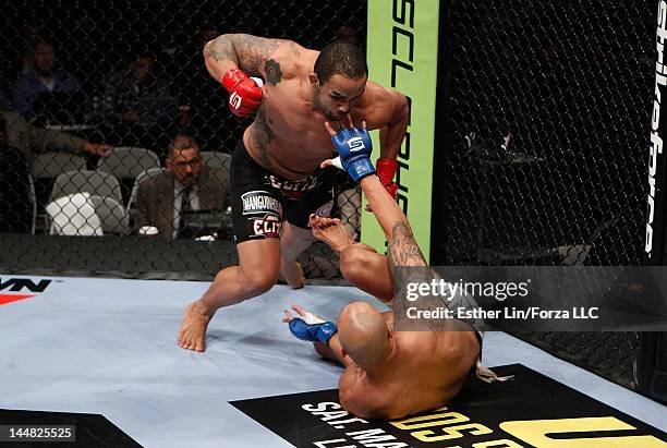 Rafael Cavalcante moves in to punch Mike Kyle during the Strikeforce event at HP Pavilion on May 19, 2012 in San Jose, California.