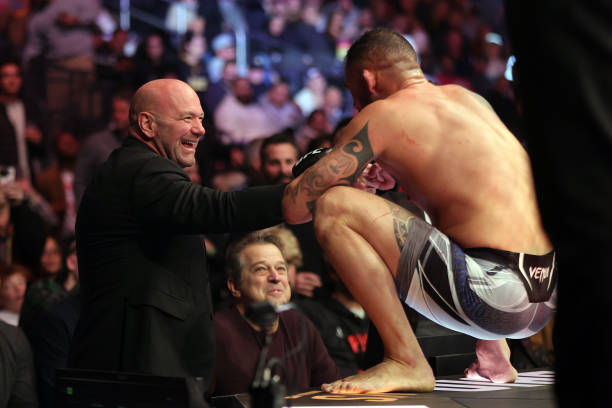 President Dana White interacts with Santiago Ponzinibbio of Argentina after defeating Alex Morono in a 180-pound catchweight fight during the UFC 282...
