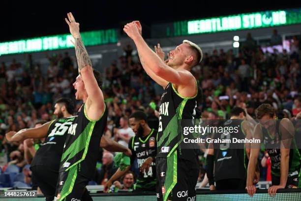 Mitchell Creek of the Phoenix and his teammates celebrate during the round 10 NBL match between South East Melbourne Phoenix and Adelaide 36ers at...