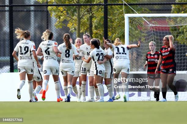 Chelsie Dawber of Adelaide celebrates scoring a goal with team mates during the round four A-League Women's match between Western Sydney Wanderers...