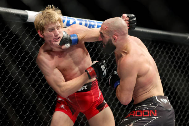 Jared Gordon punches Paddy Pimblett of England in a lightweight fight during the UFC 282 event at T-Mobile Arena on December 10, 2022 in Las Vegas,...