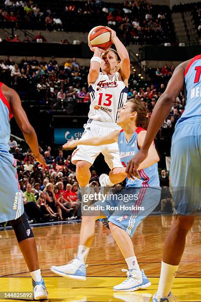 Erin Phillips of the Indiana Fever shoots against Laurie Koehn of the Atlanta Dream at Bankers Life Fieldhouse on May 19, 2012 in Indianapolis,...