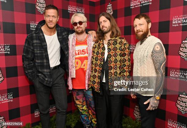 Dan Reynolds, Daniel Platzman, Wayne Sermon and Ben McKee of Imagine Dragons attend Audacy's "KROQ Almost Acoustic Christmas" at The Kia Forum on...