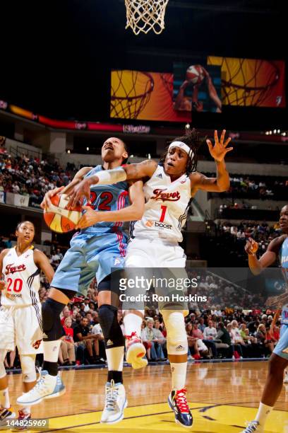 Armintie Price of the Atlanta Dream attempts a shot against Shavonte Zellous of the Indiana Fever at Bankers Life Fieldhouse on May 19, 2012 in...