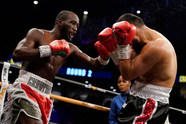 Champion Terence Crawford punches David Avanesyan during their welterweight title fight at CHI Health Center on December 10, 2022 in Omaha, Nebraska.