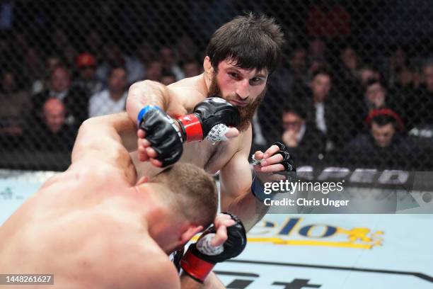 Magomed Ankalaev of Russia punches Jan Blachowicz of Poland in their UFC light heavyweight championship fight during the UFC 282 event at T-Mobile...