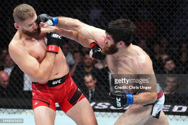 Magomed Ankalaev of Russia punches Jan Blachowicz of Poland in their UFC light heavyweight championship fight during the UFC 282 event at T-Mobile...