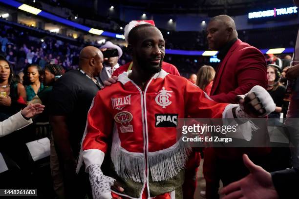Champion Terence Crawford leaves the ring after knocking out David Avanesyan during their welterweight title fight at CHI Health Center on December...