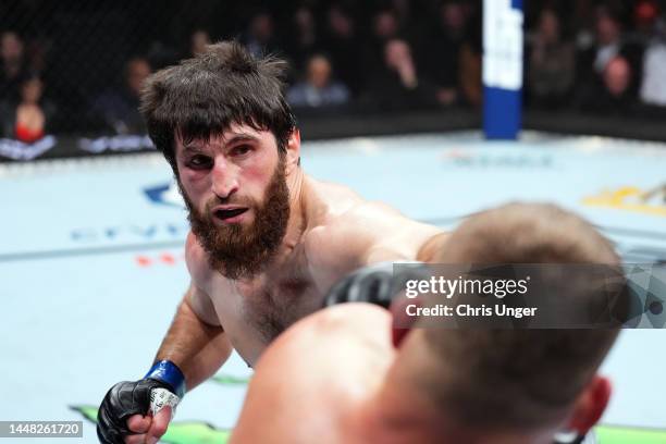 Magomed Ankalaev of Russia punches Jan Blachowicz of Poland in their UFC light heavyweight championship fight during the UFC 282 event at T-Mobile...