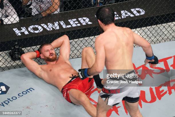 Jan Blachowicz of Poland waits on his back for a move from Magomed Ankalaev of Russia in their UFC light heavyweight championship fight during the...
