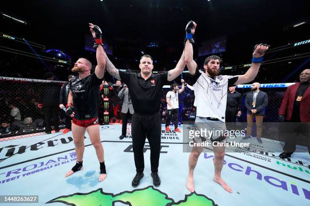 Jan Blachowicz of Poland and Magomed Ankalaev of Russia react after their UFC light heavyweight championship fight results in a split draw during the...
