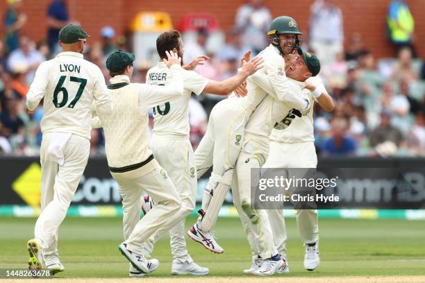 Marnus Labuschagne of Australia with Alex Carey of Australia after he took the catch to dismiss Roston Chase of West Indiesduring day four of the...