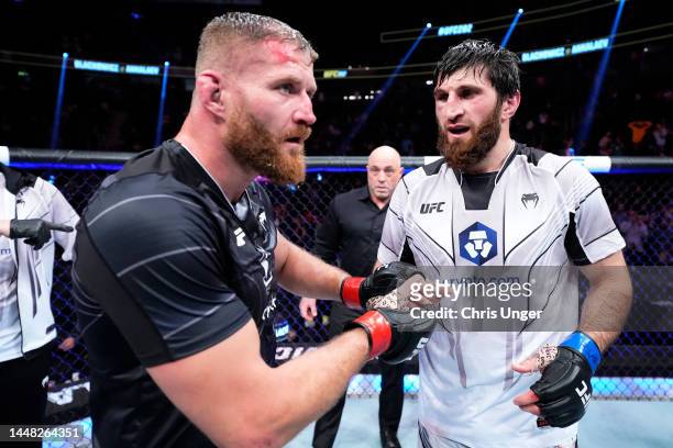 Jan Blachowicz of Poland and Magomed Ankalaev of Russia react after their UFC light heavyweight championship fight resulted in a split draw during...