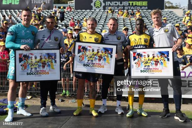 Garan Kuol, Jason Cummings and Danny Vukovic receive their thank you awards from former socceroos Matt Simon, Andy Bernal and Luke Wilkshire during...