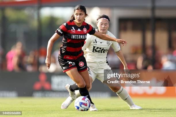 Alexia Apostolakis of the Wanderers competes with Xiao Yuyi of Adelaide during the round four A-League Women's match between Western Sydney Wanderers...