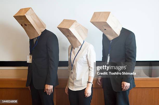 paper bag on head - face down cards stock pictures, royalty-free photos & images