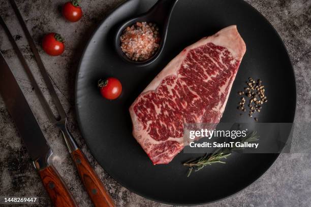 raw fresh beef steak on dark background - ribs overhead stock pictures, royalty-free photos & images