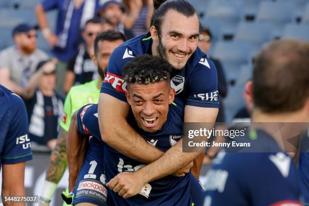 Ben Folami of the Victory celebrates the win and his goal with team mate Nicholas D'Agostino of the Victory during the round seven A-League Men's...