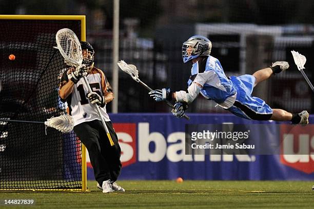 Jim Connolly of the Ohio Machine leaps and fires a shot for a goal on goalie John Galloway of the Rochester Rattlers in the second quarter on May 19,...