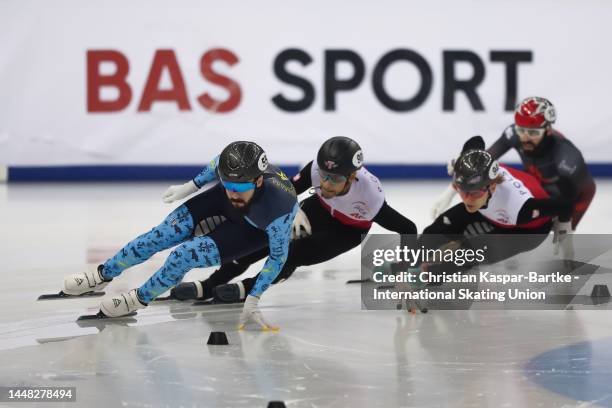 Denis Nikisha of Kazakhstan, Diane Sellier of Poland, Lukasz Kuczynski of Poland and Steven Dubois of Canada compete in Men's 500m Quarterfinal race...