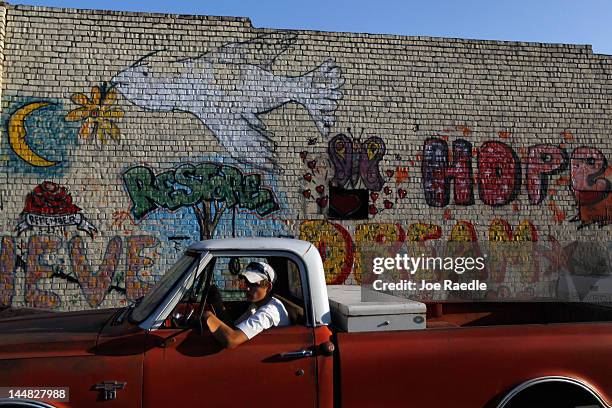 Wall is filled with hopeful messages as the town rebuilds after a tornado hit almost one year ago on May 19, 2012 in Joplin, Missouri. Tuesday will...