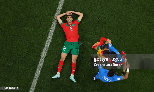 Achraf Hakimi of Morocco celebrates with Yassine Bounou of Morocco and other teammates after the 1-0 win during the FIFA World Cup Qatar 2022 quarter...