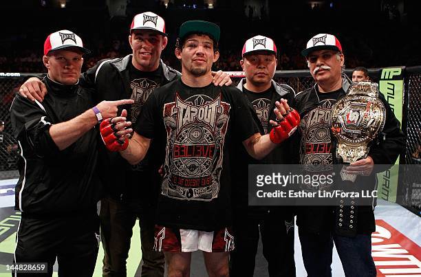 Gilbert Melendez celebrates with his team after his win over Josh Thomson during the Strikeforce event at HP Pavilion on May 19, 2012 in San Jose,...
