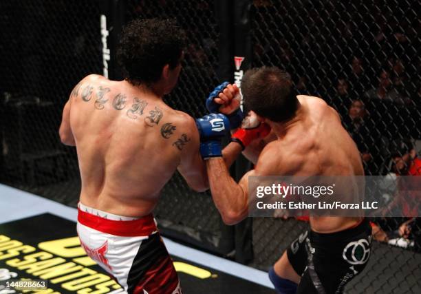 Gilbert Melendez punches Josh Thomson during the Strikeforce event at HP Pavilion on May 19, 2012 in San Jose, California.